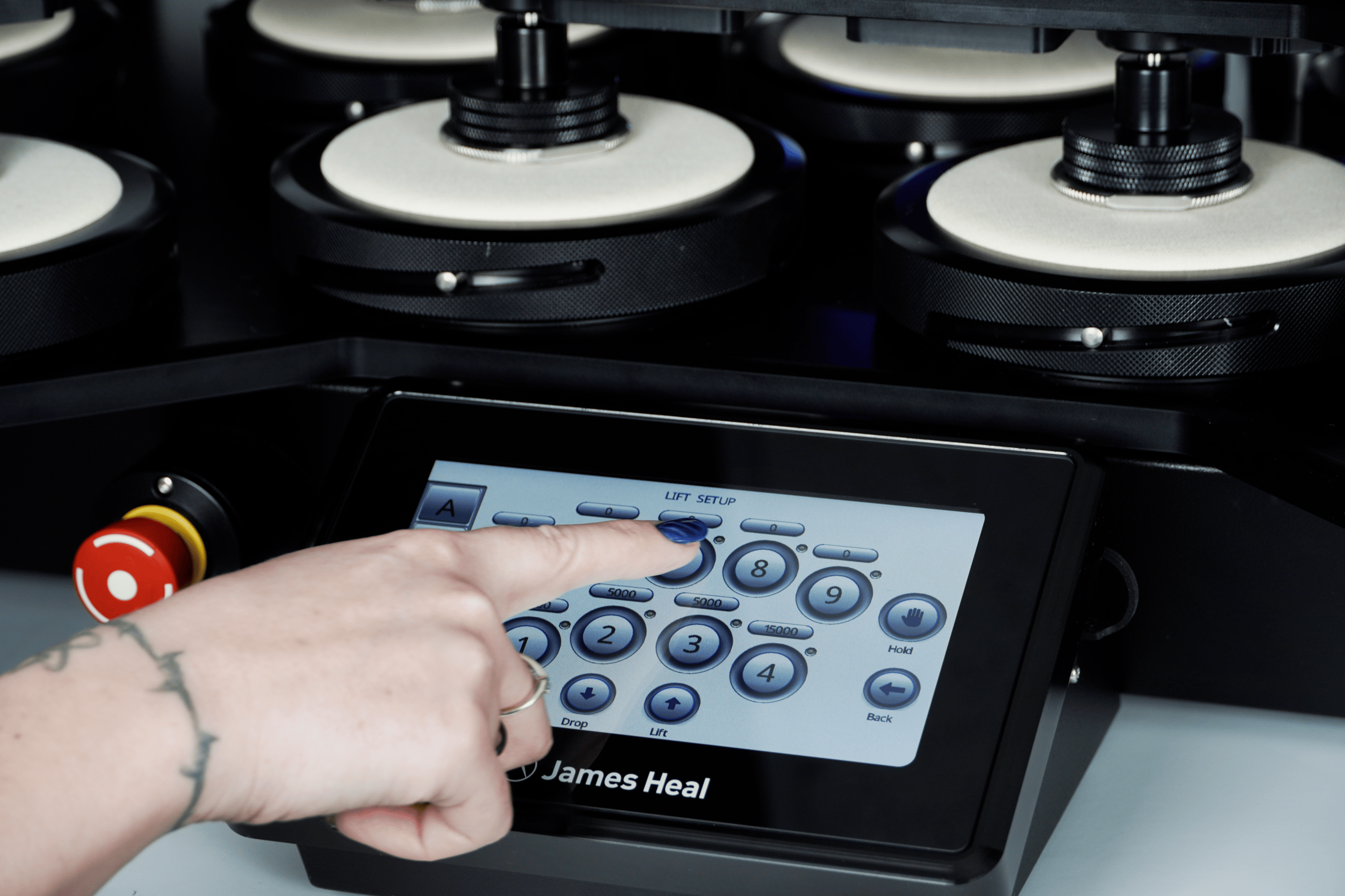 Close up of operator interacting with TestWise Touch instrument controls