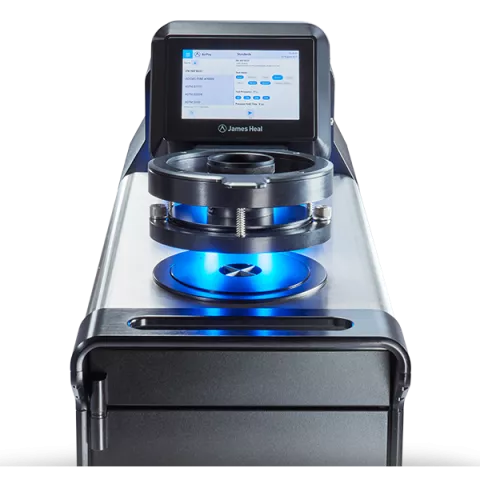 James Heal - AirPro air permeability tester - close up of uplit testing head and touchscreen