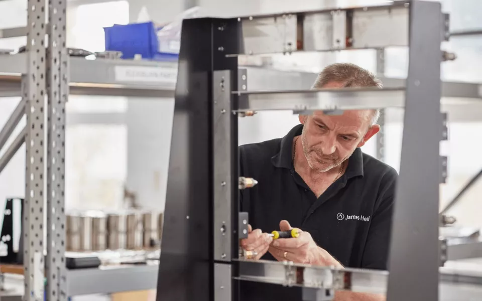 James Heal service engineers maintaining textiles lab test equipment.