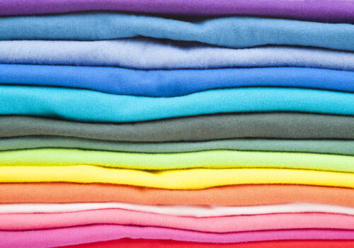 pile of fabrics in multiple colours