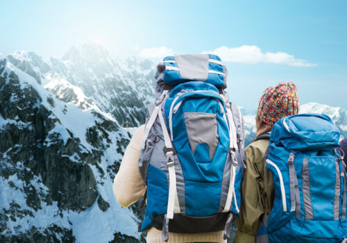 Backpacks and outdoorwear in mountain setting