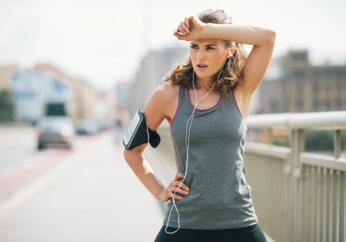 Woman on run over bridge in sportswear